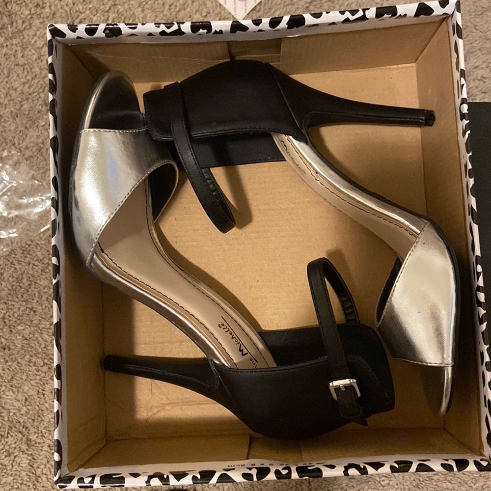 Woman’s Silver & Black heels for sale